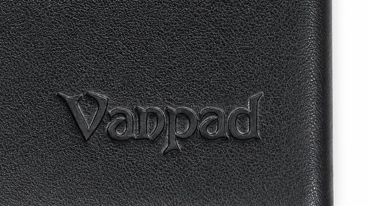 Pressed black logo on textured notebook cover